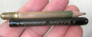 Small tube with Singer name, containing a pencil which may not be original.